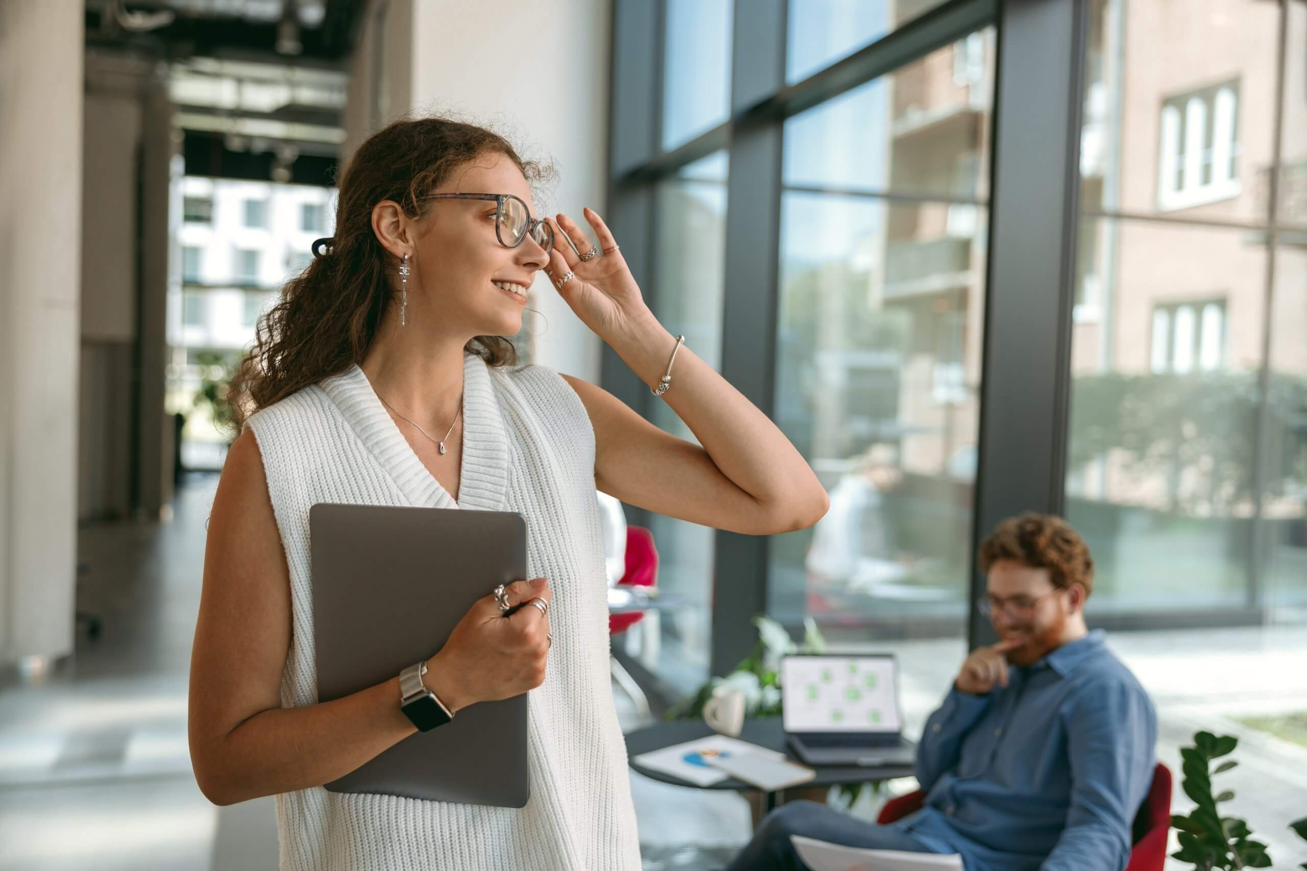 Smiling,Woman,Sales,Manager,In,Eyeglasses,With,Laptop,Standing,In